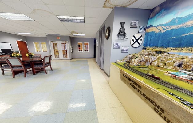 Common area with model train display and seating