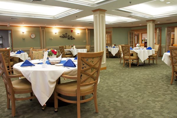 Dining area with tables set for meal service