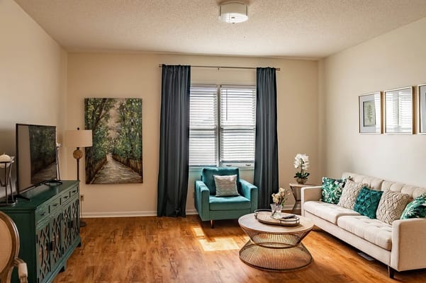Bright, inviting common area with furniture and artwork