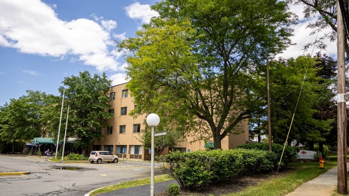 Exterior of Waterview Villa with trees and parking area