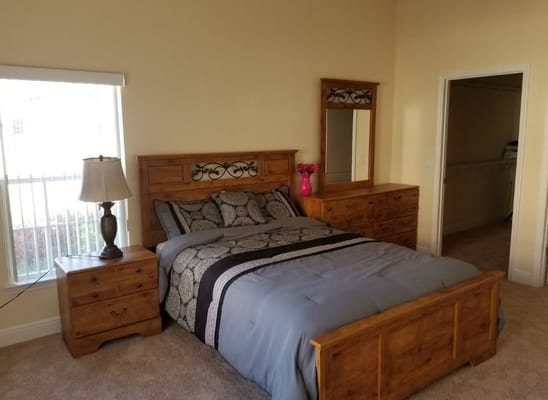 A private resident room with a bed and furniture