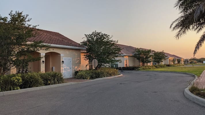 Exterior view of the assisted living facility at sunset