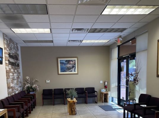 Interior waiting area with seating and artwork