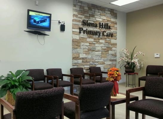 Interior waiting area with seating and plants