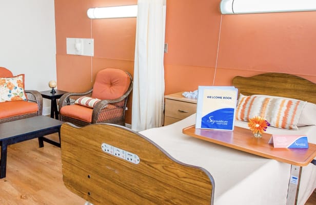 Bright room with seating area and welcome book