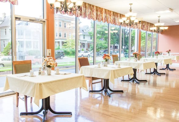 Dining room with tables set for residents