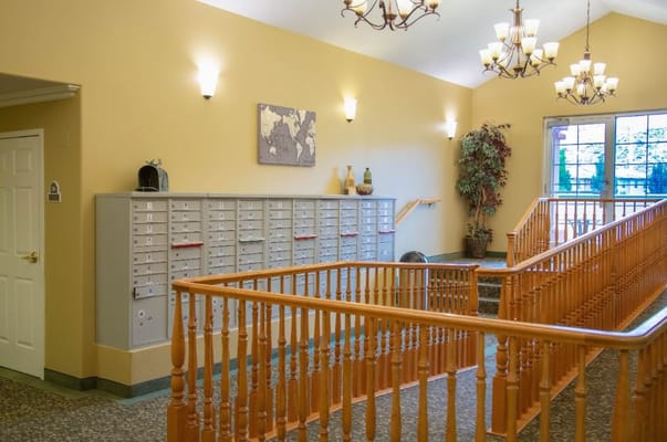 Interior view of a lobby area with mailboxes