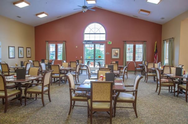Bright dining room with tables and chairs
