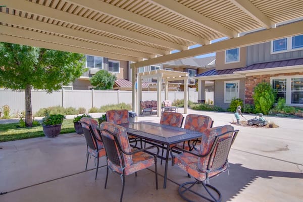 Outdoor seating area with a table and chairs