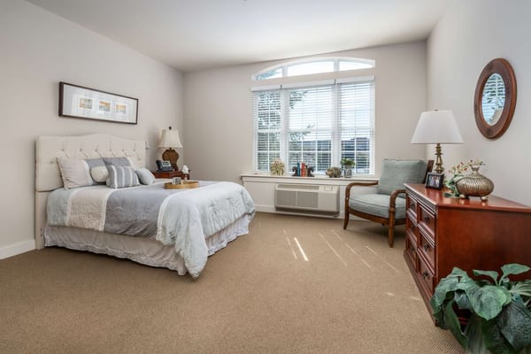 Well-furnished resident room with ample natural light