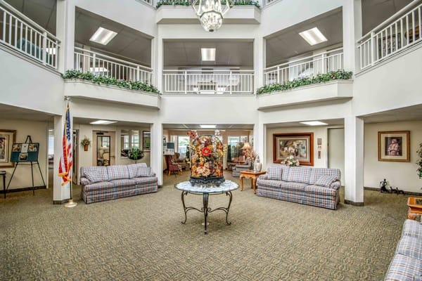 Bright and welcoming lobby area with seating and decorative fountain