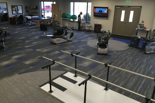 Therapy gym with equipment and exercise stations