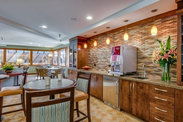 Bright common area with a snack bar and seating