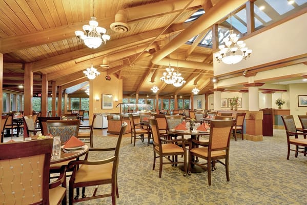 Dining area with wooden beams and pendant lights