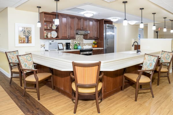Bright common area with kitchen and seating