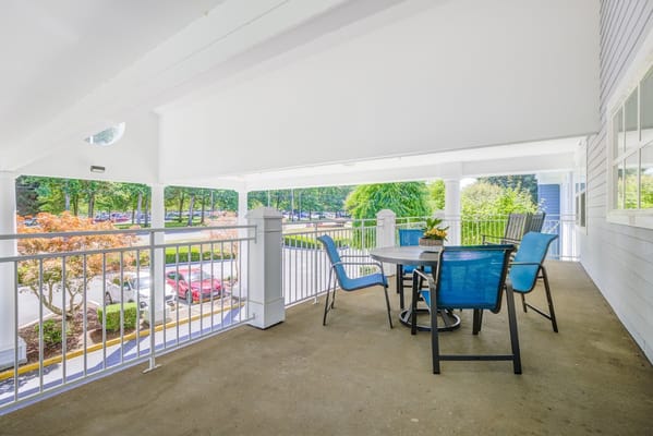 Outdoor seating area on a covered balcony