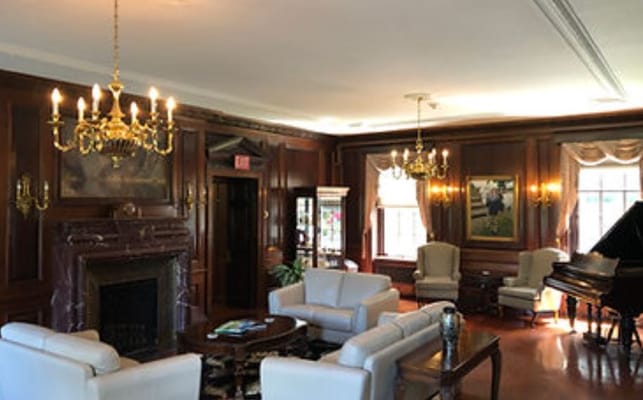 Cozy common area with seating and piano