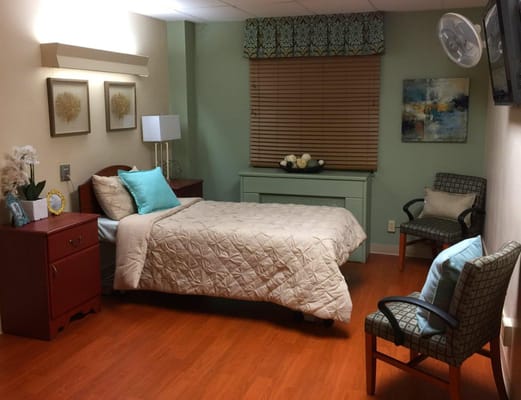 Cozy resident room with bed and seating area