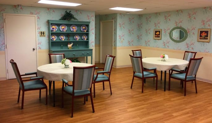 Bright common area with tables and chairs