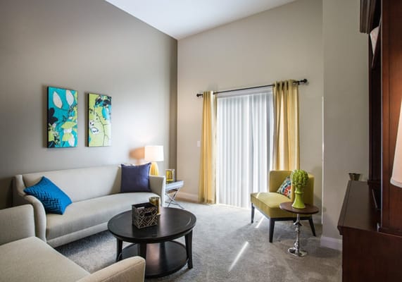 Bright living room with comfortable seating and decorative art