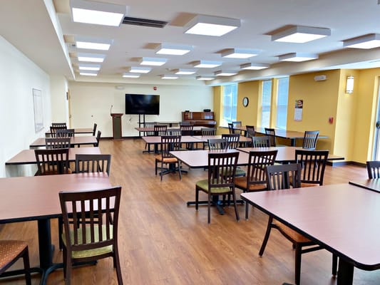 Spacious dining room with tables and chairs