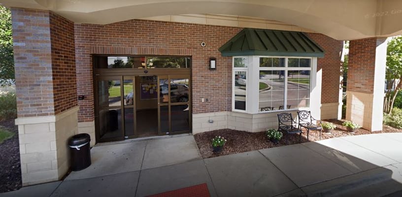 Front entrance of a nursing facility with seating