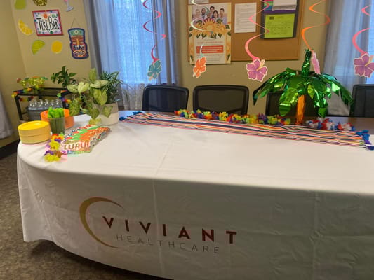 Decorated table for luau event at Viviant Healthcare.
