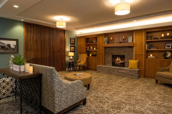 Cozy common area with a fireplace and seating