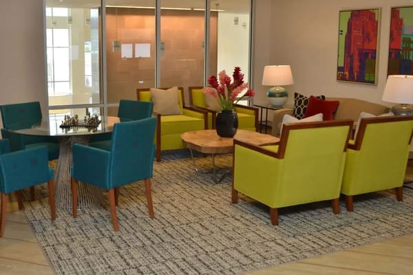 Bright and inviting living room with colorful seating and decor