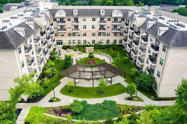 Aerial view of the courtyard featuring greenery and a pergola.