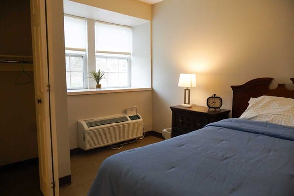 Cozy resident room with a bed and window