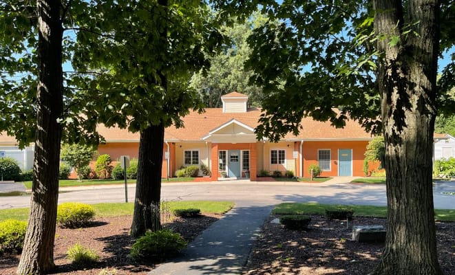 Exterior view of the Hope Alzheimer's Center surrounded by trees
