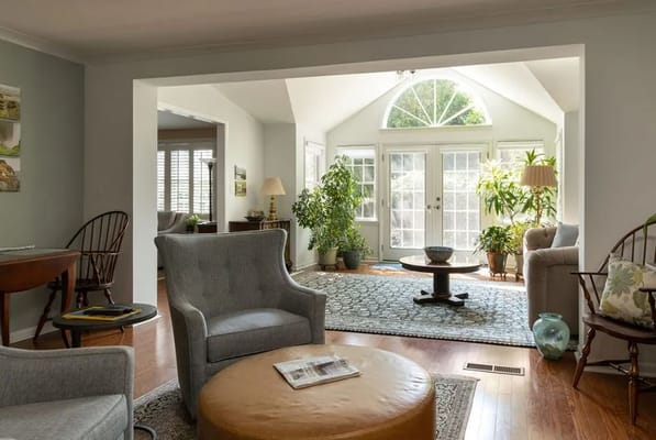 Cozy living room with plants and natural light.