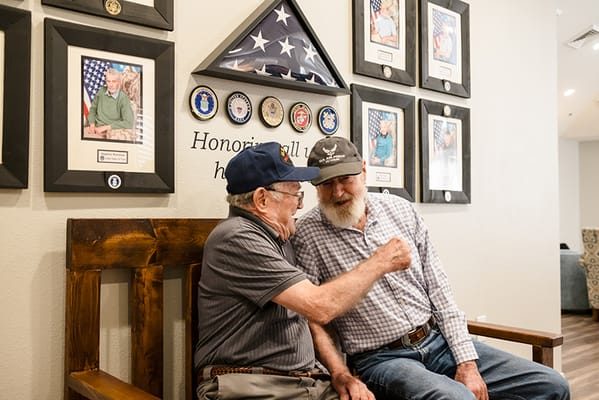 Two residents sharing a moment in a common area