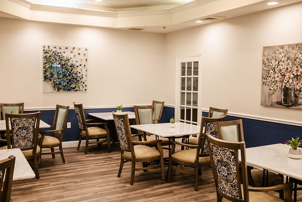 Bright dining area with tables and chairs