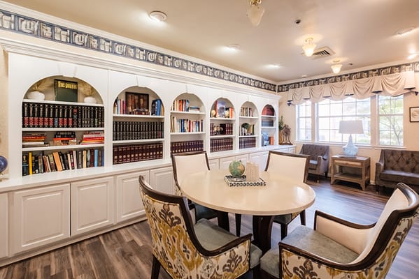 Common area with bookshelves and seating