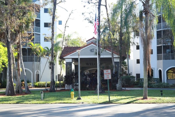 Main entrance of Forest Trace Senior Living with welcoming sign