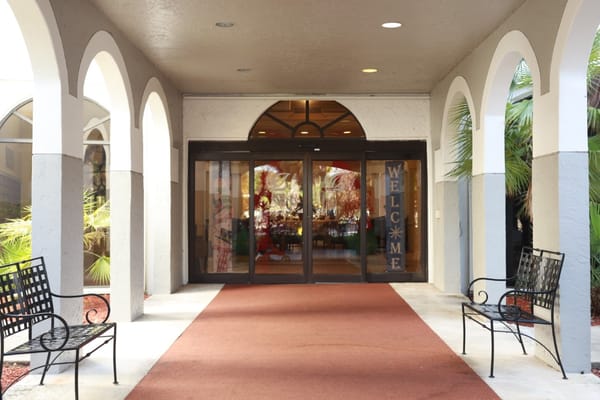 Entrance welcoming residents with seating area