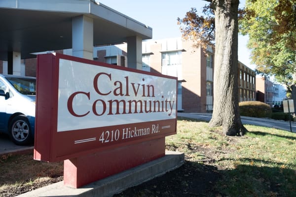 Sign for Calvin Community with building in background