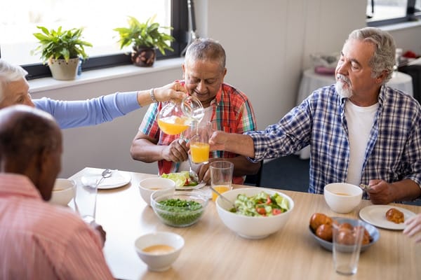 Residents enjoying a meal together in a dining area