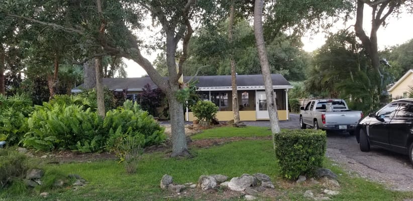 Exterior view of a senior living facility surrounded by greenery