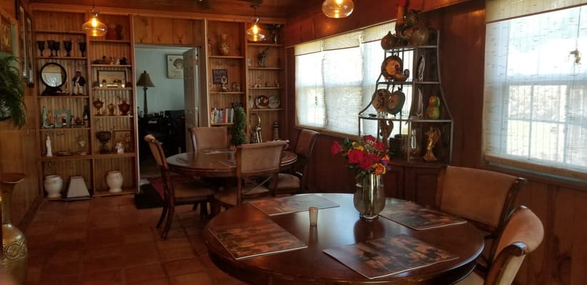 Cozy common area with wooden decor and tables