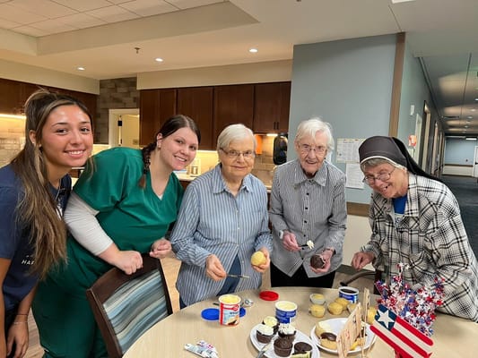 Residents and staff enjoying ice cream together