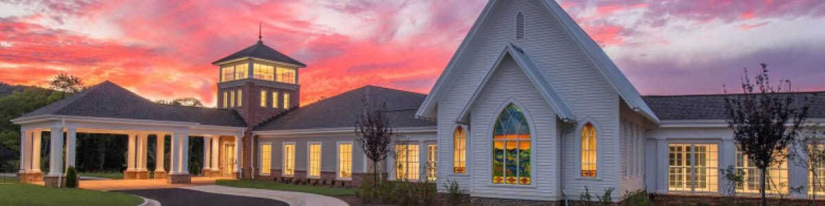 Exterior view of a senior care facility during sunset