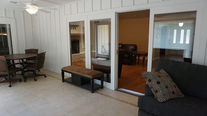 Bright common area with seating and dining table