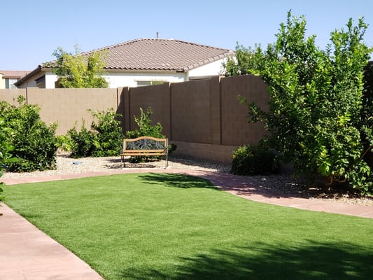 Well-maintained garden area with seating.