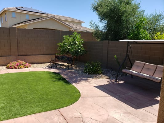 Serene outdoor space with a swing and landscaped garden