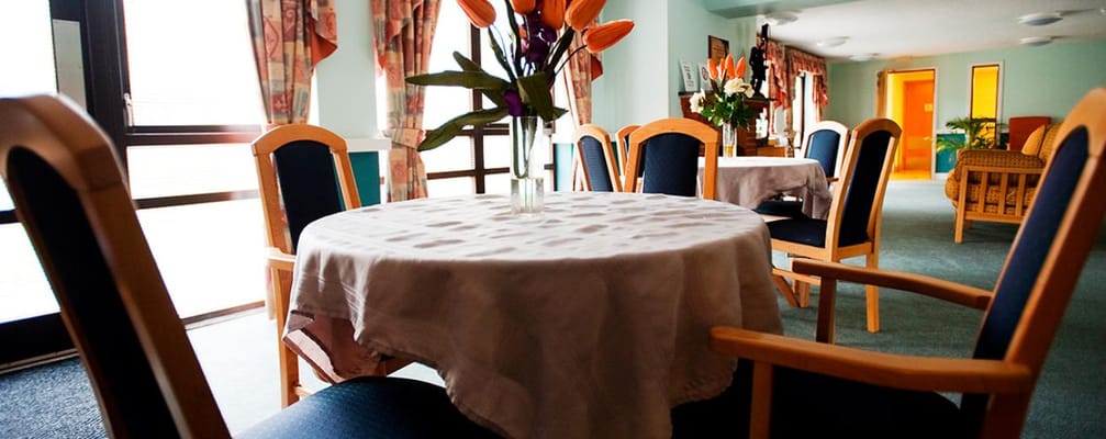 Bright common area with tables and chairs