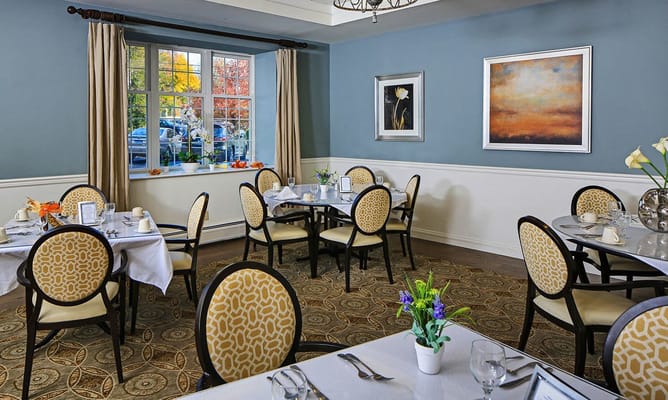Dining area with elegantly set tables and a view