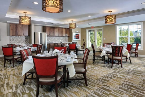 Elegant dining room setup with tables and chairs
